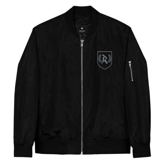 Rurik Fightgear-lentäjänpusakka.
Rurik FG "R" -logo rintapielessä sekä riimulogo selässä monivärisesti brodeerattuna. Kuvassa pilottitakki  edestä. PT-Combat.Fi